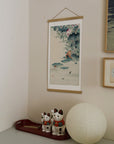 Frog and tadpoles – Ohara Koson art print 30 x 60 cm on a wooden poster hanger in an interior
