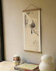 Two doves on a branch – Ohara Koson art print 30 x 60 cm on a wooden poster hanger in an interior