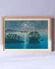 Framed Japanese Art Poster by Kawase Hasui, featuring a serene moonlit night with small islands on the sea
