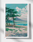 Japanese Art Poster by Kawase Hasui - Serene beach with pine trees and majestic mountain in the background