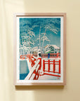 Framed Japanese Art Poster by Kawase Hasui featuring a woman with an umbrella crossing a red bridge in the snow
