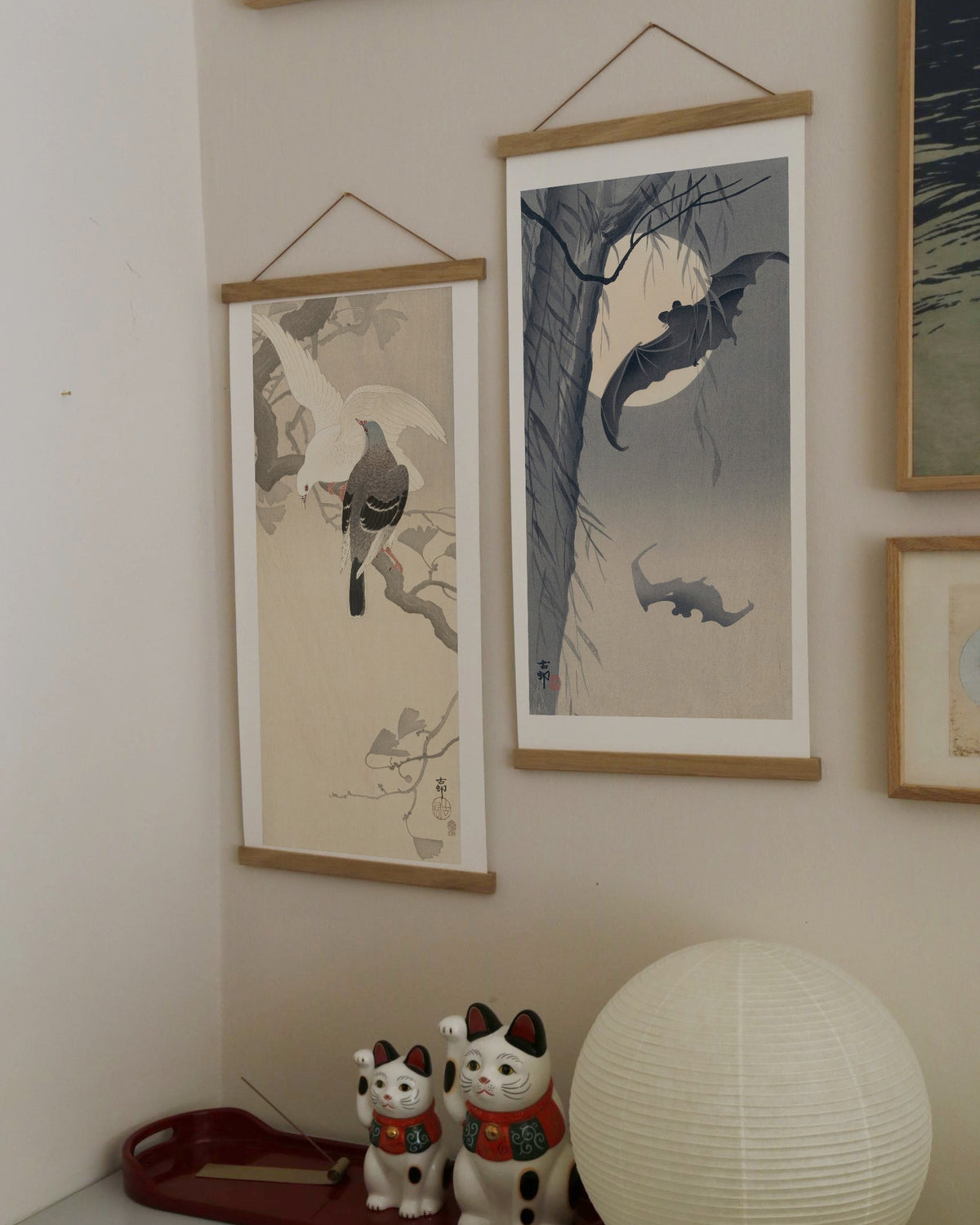 Bats and full moon – Ohara Koson art print 30 x 60 cm on a wooden poster hanger in an interior