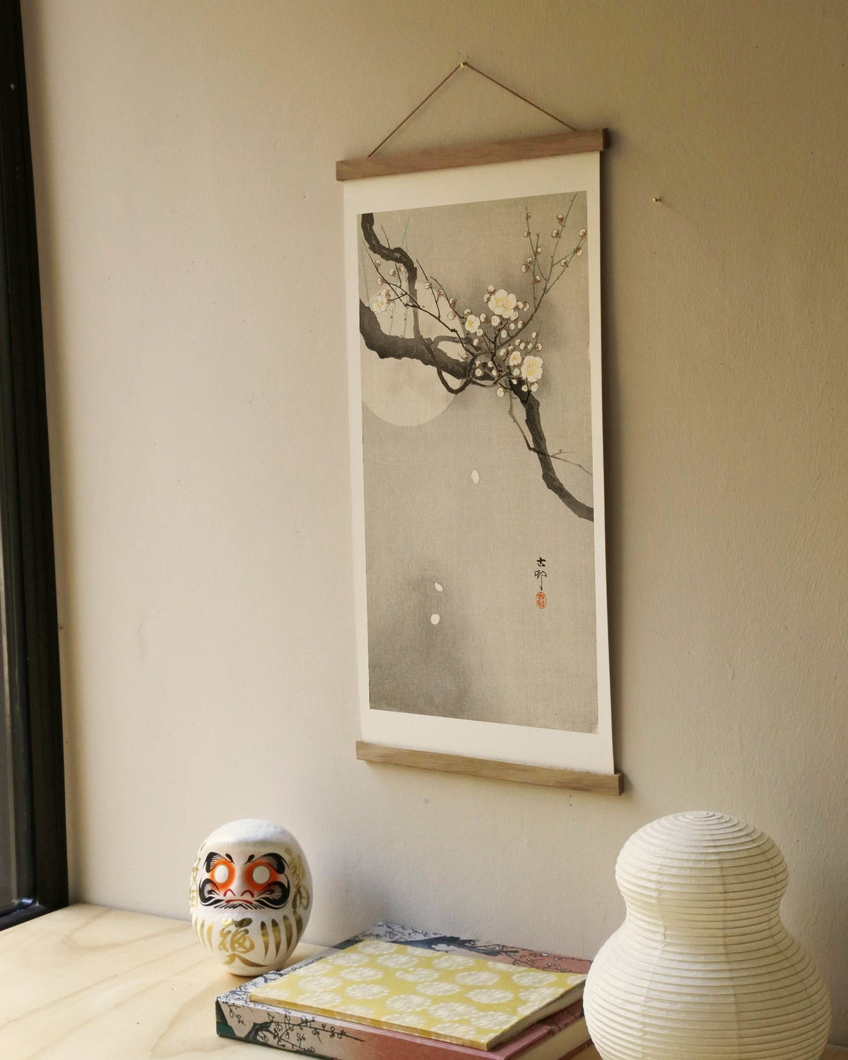 Plum blossom and full moon – Ohara Koson art print 30 x 60 cm on a wooden poster hanger in an interior