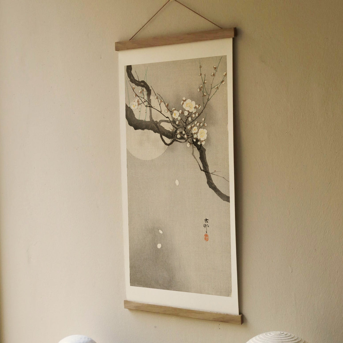 Plum blossom and full moon – Ohara Koson art print 30 x 60 cm on a wooden poster hanger in an interior