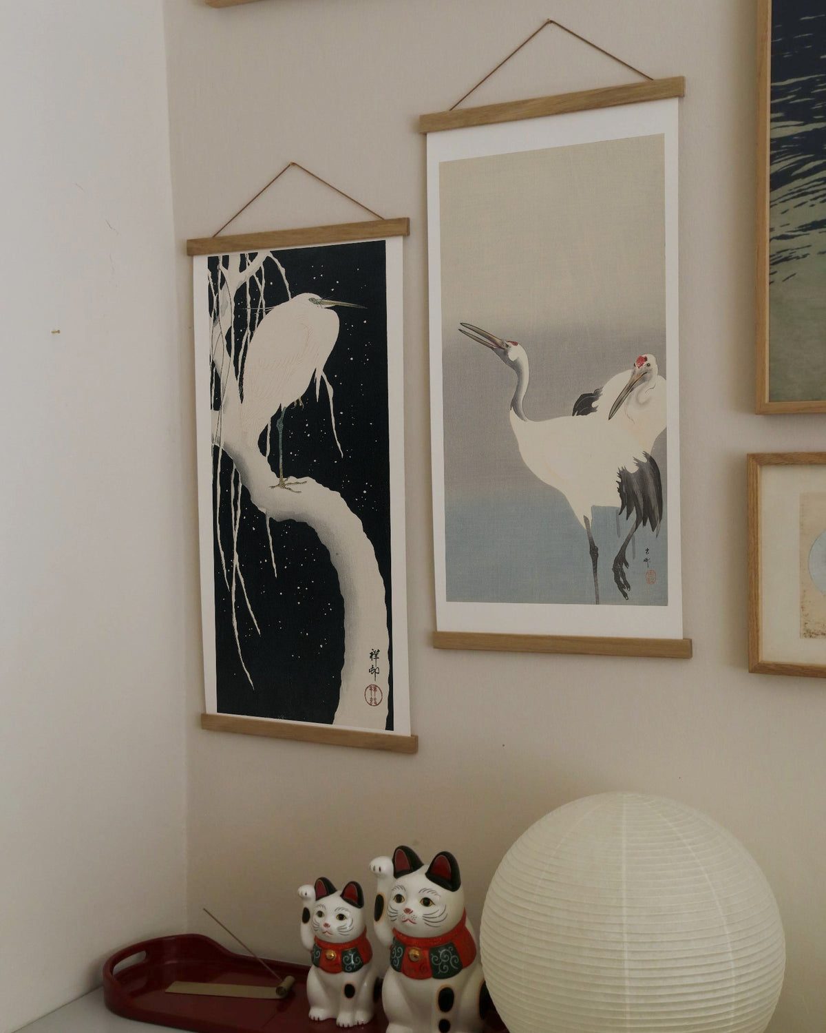 Two cranes – Ohara Koson art print 30 x 60 cm on a wooden poster hanger in an interior